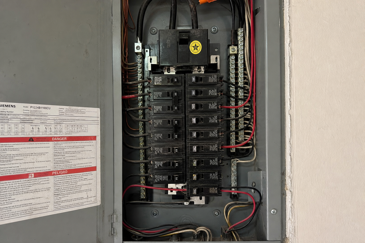 Open electrical panel photographed during a Four Point electrical inspection